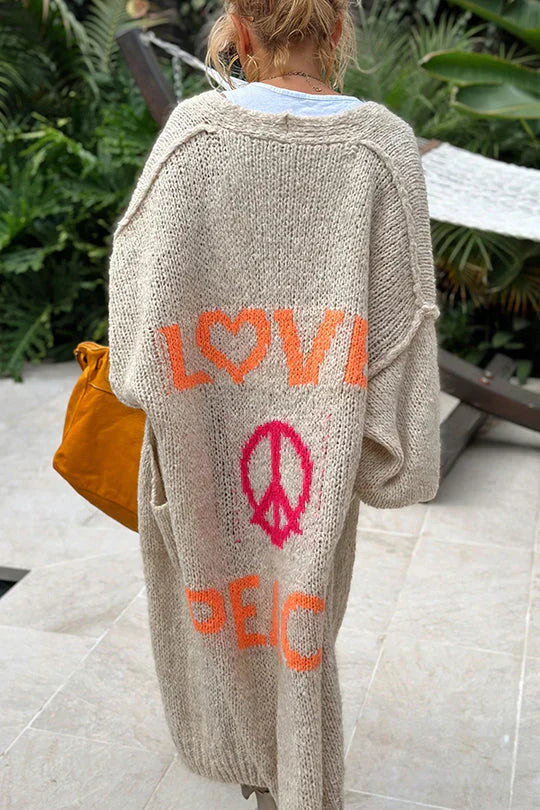 Modische Strickjacke mit Friedenssymbol